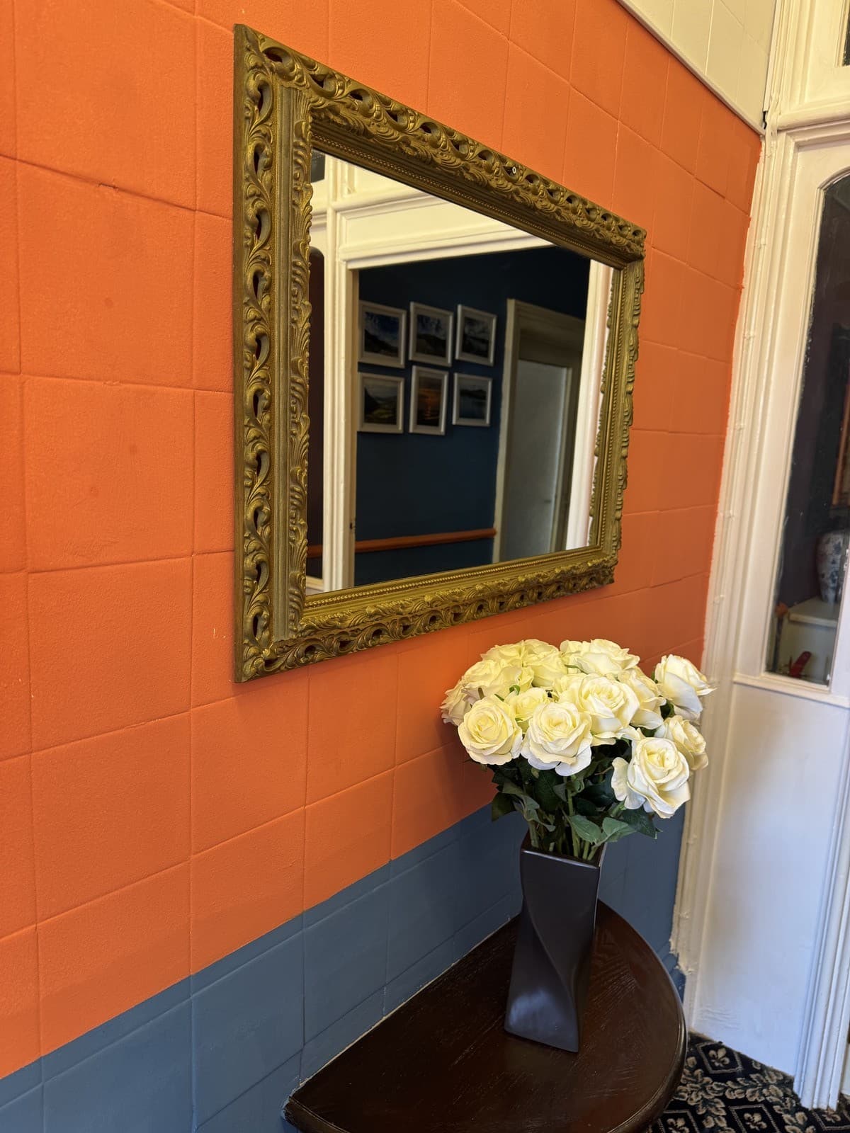 Gold mirror with white roses